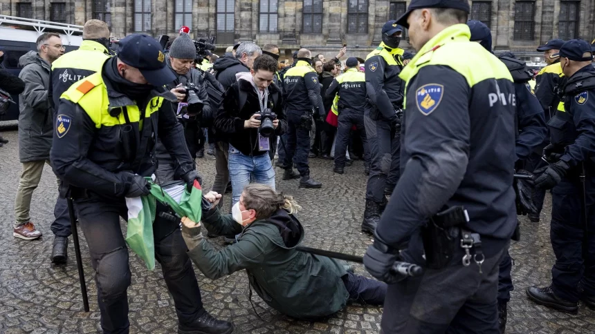 Dozens detained after protesters defy ban in Amsterdam