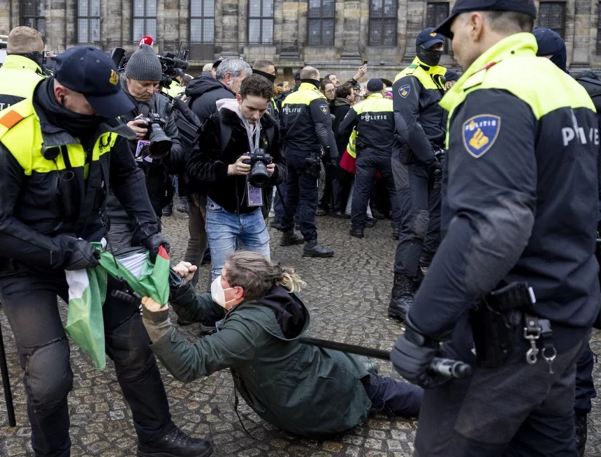 Dozens detained after protesters defy ban in Amsterdam