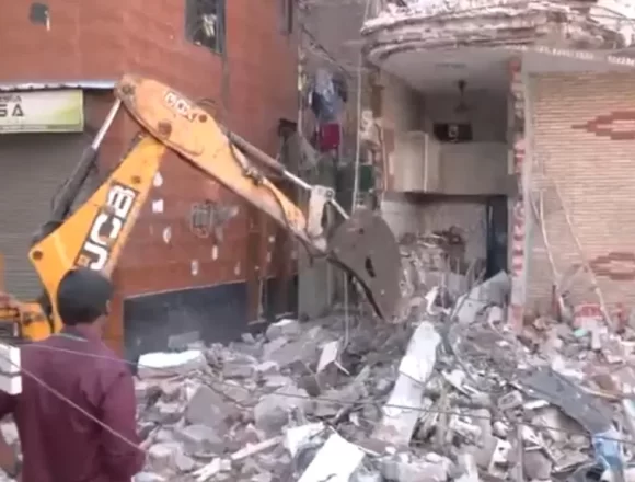 Bulldozer Action in Uttam Nagar: MCD Demolishes Illegal Portions of Accused’s House in Holi Clash Murder Case Bulldozer Action in Uttam Nagar: MCD Demolishes Illegal Portions of Accused’s House in Holi Clash Murder Case