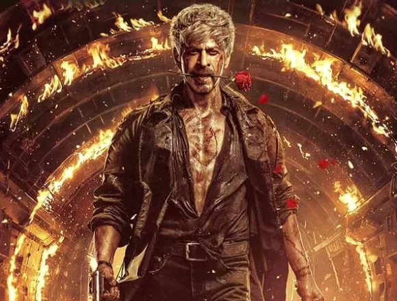 SRK unveils new KING poster with a rose between his lips and bloodied face